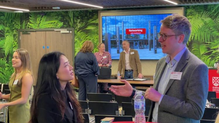 people chatting at an event